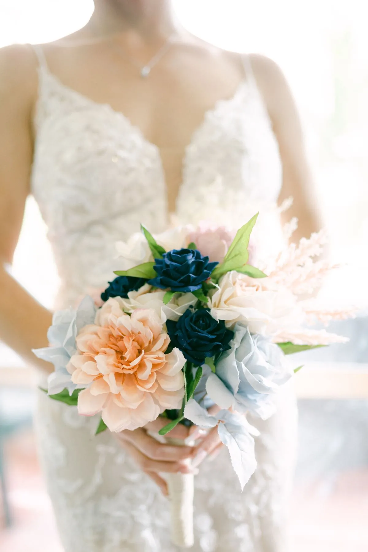 Bridal bouquet and gown detail