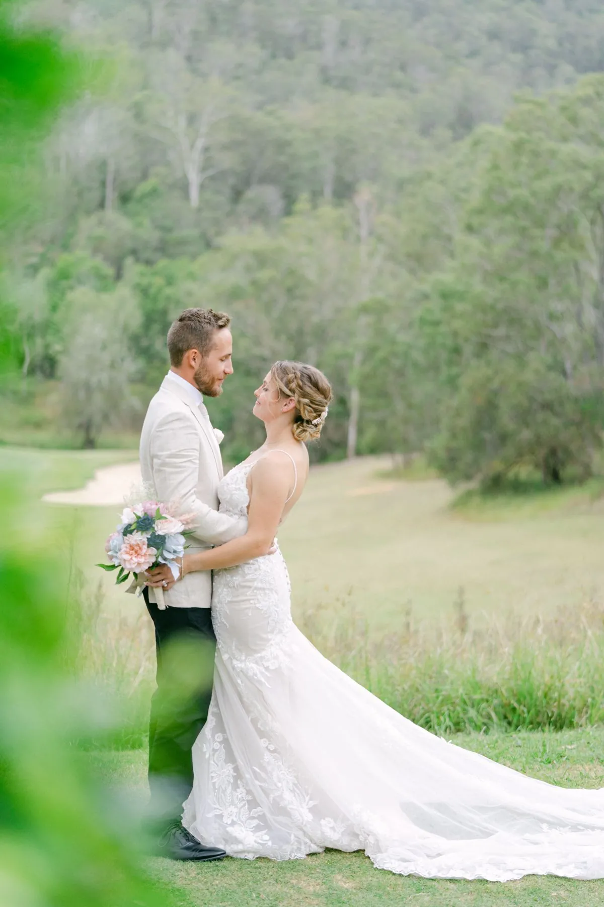 Wedding couple with a sports car at The Kooralbyn Valley