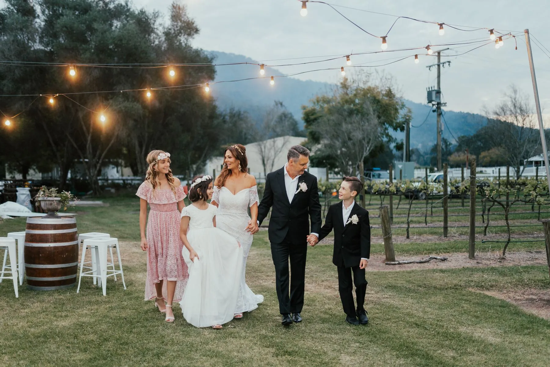 Wedding couple embracing in a Scenic Rim vineyard